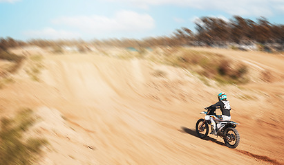 Image showing Sports, fitness and person with motorcycle, speed and action with power in desert, race or rally with athlete outdoor. Dirt bike, exercise and extreme sport mockup, freedom and adventure with travel