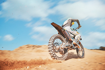 Image showing Back of motorbike, offroad sports and speed on blue sky, desert sand or trail. Driver, cycling and power on dirt track, hill and motorcycle performance competition on adventure course for fast action