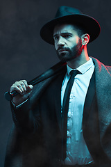 Image showing Fashion, criminal and man with bat for violence for vintage, retro and Victorian gangster on dark background. Crime aesthetic, thinking and male model with designer suit, weapon and threatening face