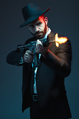 Image showing Man, suit or shooting gun on dark studio background in secret spy, isolated mafia leadership or crime lord security. Model, gangster or hitman firing gun in style, formal or fashion clothes aesthetic