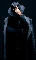 Image showing Vintage, classy and mystery man in a suit isolated on a dark background in a studio. Business fashion, retro and stylish secret businessman for crime investigation, spy work and agent on a backdrop