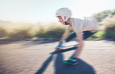 Image showing Skate, blurred motion and speed with a sports man skating on an asphalt road outdoor for recreation. Skateboard, soft focus and fast with a male athlete or skater training outside on the street