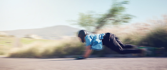 Image showing Speed, skateboard and man in action on road ready for adventure, freedom and extreme sports motion blur. Training, skateboarding and skater with longboard for exercise, skating and fitness hobby