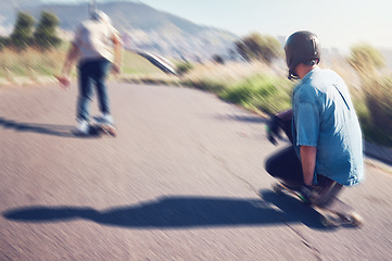 Image showing Sports, skateboard and friends with speed in action on road ready for adventure, freedom and motion blur. Friendship, skateboarding and skaters with longboard for exercise hobby, skating and fitness