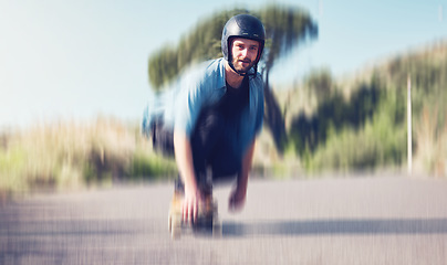 Image showing Skater, motion blur and speed with a sports man skating on an asphalt road outdoor for recreation. Skate, soft focus and fast with a male athlete on a skateboard training outside on the street