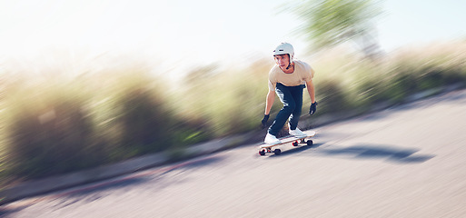 Image showing Motion blur, skating and mockup with a sports man training outdoor on an asphalt street at speed. Skateboard, fast and mock up with a male skater on a road for fun, freedom or balance outside