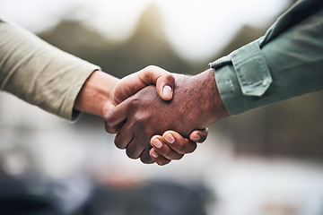 Image showing People, hands and handshake for deal, trust or agreement in partnership, unity or support on a blurred background. Hand of team shaking hands for community, teamwork or collaboration in the outdoors