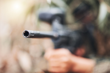 Image showing Paintball, gun and aim with army training for the military outdoor on a battlefield to simulate war. Sports, exercise and zoom with a soldier outside for target practice or competitive challenge