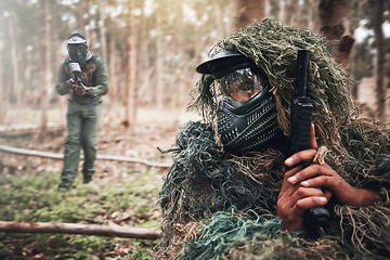 Image showing Military, camouflage and people on a field playing paintball for exercise, fun and sport in Mexico. Fitness, action and person hiding while on battlefield for a game, competition or war with friends