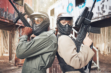 Image showing Paintball, team and gun with solidarity and sports, game on battlefield with war, partnership and support in portrait. Motivation, mask for safety, people on shooting range with trust and confidence