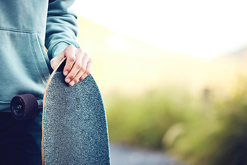 Image showing Skateboard, sports and hands of man in park ready for adventure, skateboarding and fitness in city. Copy space, mockup and male skater with longboard for exercise, skating and training outdoors