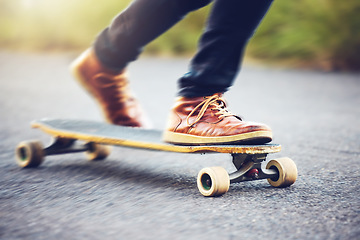 Image showing Street, shoes on skateboard and longboard skating at skatepark with speed, skill and balance on road. Freedom, urban fun and gen z skateboarder hobby, legs and skate trick skateboarding for transport