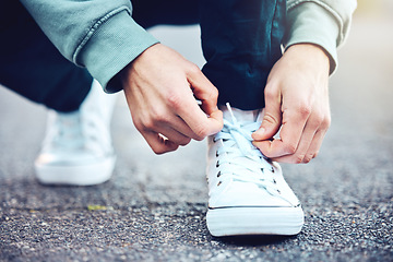 Image showing Road, hands and man tie shoes on street to start fitness walk on holiday or vacation outdoors. Travel, wellness and male traveller tying sneakers laces and getting ready for walking, journey or trek.
