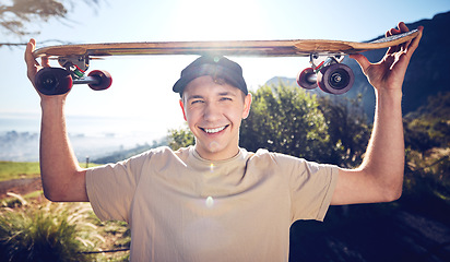 Image showing Sports, skateboard and portrait of man on mountain for adventure, freedom and ready for skateboarding. Fashion, fitness and face of skater smile with longboard for exercise, skating and training