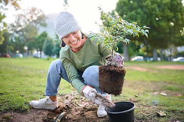 Image showing Community service, volunteering and woman plant trees in park, garden and nature for sustainability. Climate change, soil gardening and care for earth day, environmental support and green ecology