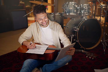 Image showing Happy, tablet and musician writing a song for a performance on a video call in the studio. Creative, planning and artist with a guitar for music production with technology for a sound website