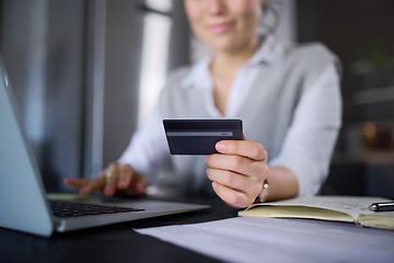 Image showing Laptop, online shopping and hands of woman with credit card for digital banking or payment. Ecommerce, fintech and female with computer for buying, paying bills or finance budget in home at night.