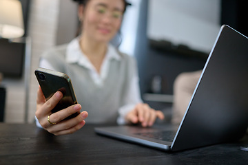 Image showing Phone, networking or Asian woman with laptop for communication, social media or website blog content reading. Hand, typing or girl with smartphone for planning, research or internet digital search