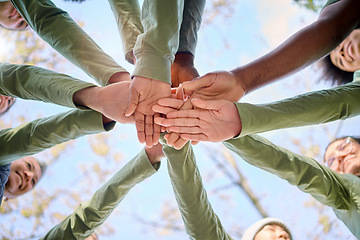 Image showing Teamwork, collaboration and low angle of people with hands together for team building. Motivation, solidarity and group of men and women huddle for unity, union or community, support or cooperation.