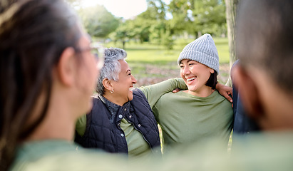 Image showing Friends, hug and happy volunteer people outdoor at a nature park in summer. Men and women diversity group for community service in green ngo tshirt for recycling, cleaning and a clean enviroment