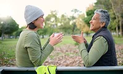 Image showing Women, coffee and volunteer relax after community, cleanup and project in a park, happy and bonding. Charity, environment and recycling friends resting in a forest with tea, cheerful and content