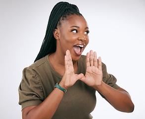 Image showing Wow, announcement and excited with a black woman in studio on a gray background to share news. Hands, promotion and information with a young female indoor sharing a secret as a brand ambassador