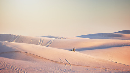 Image showing Motorcycle, Dubai desert or man on bike for sport workout, sunset ride or exercise on hill. Nature, sky or male riding for speed adventure freedom in sand landscape training, fitness or sports race