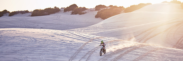 Image showing Motorcycle, sand hill or man on bike in flare lens for sport workout, sunset ride or exercise wellness. Nature, sky or male riding for speed adventure in Dubai desert for training, fitness or race