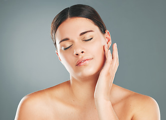 Image showing Face, woman with eyes closed, skin and peace with beauty, facial treatment and content isolated on studio background. Natural cosmetics, dermatology glow with shine and skincare with wellness mockup