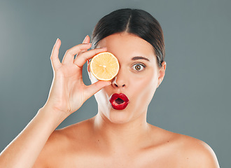 Image showing Orange, skincare, woman or wow for wellness health diet, happy results or vitamin C on grey background. Beauty portrait, spa or girl model face, facial makeup or cosmetics for aesthetic in studio