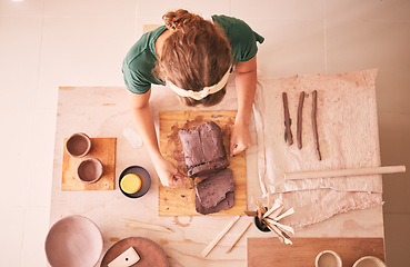 Image showing Pottery, creative and startup with a woman designer working in her studio for art from above. Manufacturing, small business and scupture with a female entrepreneur, employee or artist in a workshop