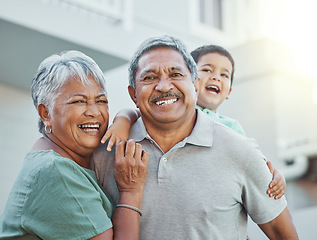 Image showing Grandparents, portrait and senior man and woman are happy with grandchild outside new home. Elderly, retirement and happiness together by old people on vacation or holiday with kid or child