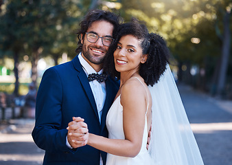 Image showing Couple portrait, wedding and happy dancing outdoor at marriage celebration event together with love. Interracial man and woman at park with trust, partnership and care for commitment to partner