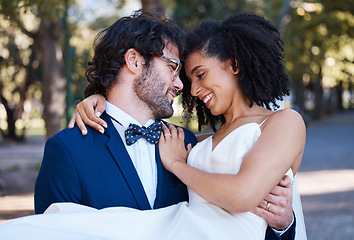 Image showing Wedding, couple and marriage outdoor with love, commitment and trust with bride and groom in park. Happiness, life partner and interracial relationship with black woman and man, hug and married