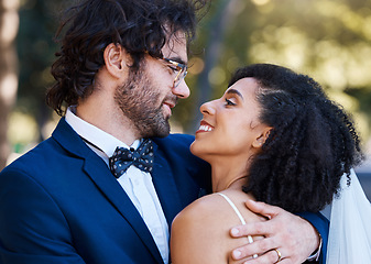 Image showing Happy couple, love and wedding celebration event together with commitment, care and support. Interracial man and woman at park with trust, marriage partnership and a hug with a smile on their face