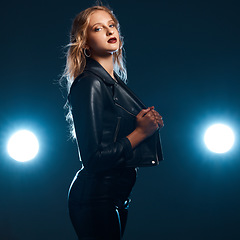 Image showing Leather, dance performance and woman portrait of isolated dancer or singer with stage lights. Dark background, studio and theatre presentation of a young female ready for creative dancing with light