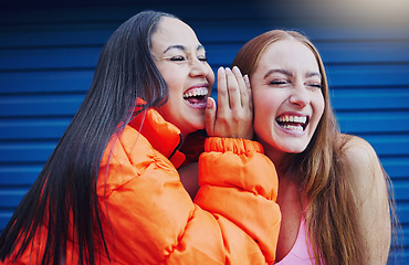 Image showing Gossip, women talking and friends, laughing and reunion, bonding and blue wall background. Ladies, happy females and girls outdoor, quality time and conversation for funny, silly story and carefree