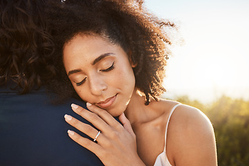 Image showing Wedding, bride and hug at sunset with embrace together for care, love and support in married life. Marriage of happy black woman hugging man in romance for commitment embracing relationship in nature