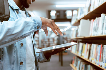 Image showing Touch screen, education or black man hand on tablet in library for research, advertising or project management. Digital or university student with tech for learning, scholarship study or web search