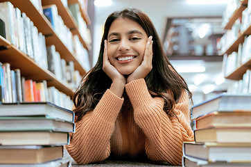 Image showing Indian woman, portrait and library for studying, higher education or knowledge for exam, test or learning. Hobby, female student or academic with books, relax or college for scholarship or university