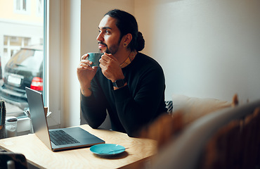 Image showing Thinking, inspiration and man in coffee shop for remote work, creative writing and relax restaurant on laptop. Computer, internet cafe and thoughtful person or student for study ideas, drinking tea