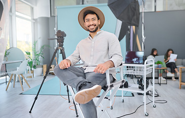 Image showing Portrait, happy and photographer in studio for photo shoot, relax and confident in professional setup. Face, asian male and magazine photography, backstage and proud while posing, smile and casual