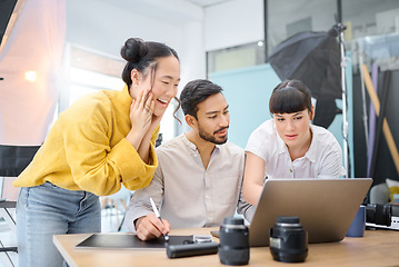 Image showing Photography, collaboration and laptop with a designer team working on a photoshoot in the studio. Photographer, teamwork or computer with a man and woman creative group for a post production edit