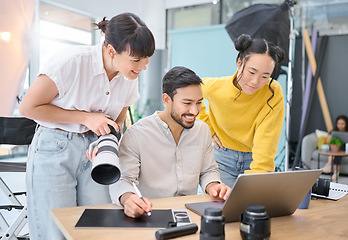 Image showing Photographer, collaboration and laptop with a designer team working on a photoshoot in the studio. Photography, teamwork or computer with a man and woman creative group for a post production edit