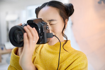 Image showing photography, camera and woman in studio shooting creative memory picture, photoshoot or digital production. Lens focus, art creativity and young Japanese photographer girl working for artistic shot