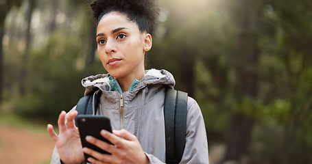 Image showing Phone, hiking and female in nature for a gps location, travel and freedom in mountains of Peru during a holiday. Young, thinking and black woman with a mobile for communication while trekking in a fo