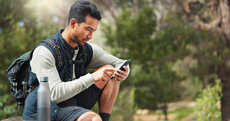 Image showing Phone, hiking and man in nature for a gps location, travel and freedom in mountains of Peru during a holiday. Young, thinking and Asian man with a mobile for communication while trekking in a forest