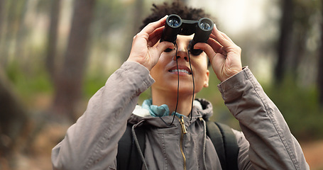 Image showing Travel, adventure and binocular hiking in nature forest for beauty, exercise and trekking journey holiday. Happy female outdoor by trees for fitness workout, freedom and health on woods vacation