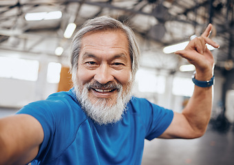 Image showing Fitness, selfie and portrait of Asian man in gym with hand sign for motivation, wellness and cardio workout. Smile, healthy body and face of senior male after training, exercise and sports goals