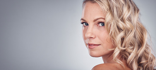 Image showing Woman, beauty and portrait smile on mockup for skincare, cosmetics or makeup against a gray studio background. Happy attractive blond female face smiling in satisfaction for facial spa treatment